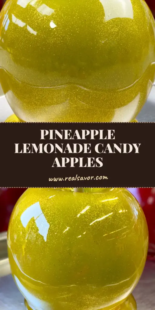 A gourmet Pineapple Lemonade Candy Apple with a thick translucent yellow sugar glaze and edible gold shimmer dust on a silver tray.
