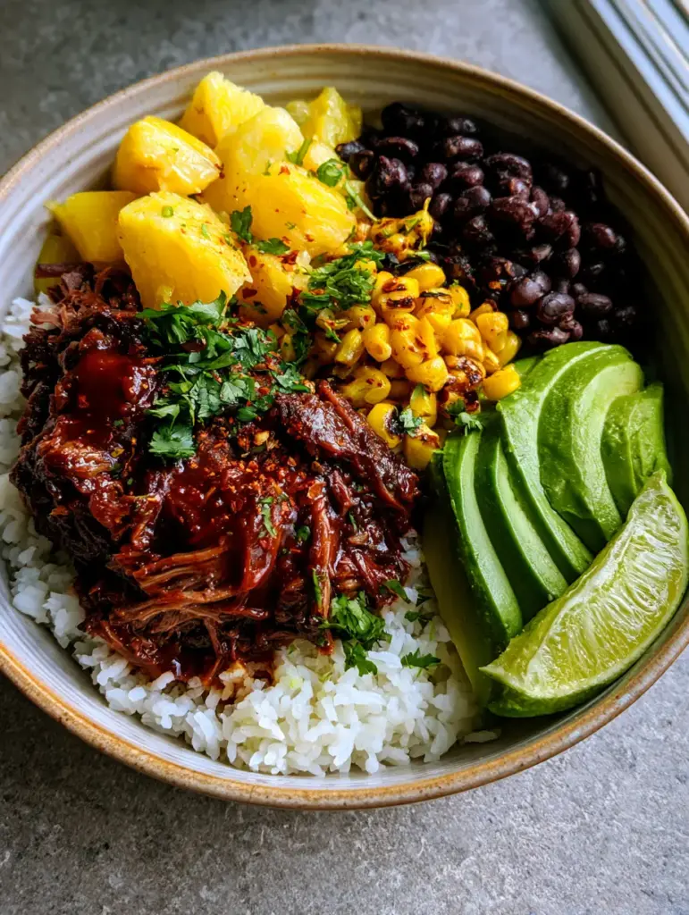 Close up of charred corn and black beans next to smoky chipotle beef and avocado slices.